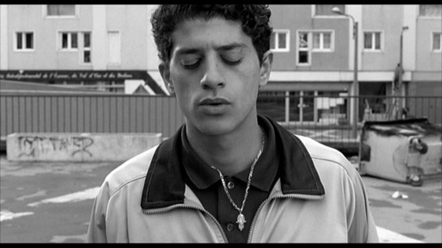 <p>Representative of the Beur/Maghreb community + the treatment of them<br>Many mentions within the film as well:<br>"un arabe dans un commissariat il ne tient pas plus d'une heure"<br>"tu veux etre le prochain rebeu a te faire fumer dans un commissariat?<br>Joker of the group: tells jokes + tries to relax the atmosphere (eg story of Batman and nun)<br>Brings a lighter side to the story and their lives - comic relief<br>Middle-man between Hubert and Vinz (toilets)<br>Has a more lax attitude to issues<br>Don't find out much about his family → opposite to the other two<br>Nordine = older brother<br>Has a sister<br>Strict family → might be based on reputation (Nordine doesn't want Said getting in trouble/in prison)<br>First shot: as he opens his eyes we seem him as a human being, not just a banlieusard</p>