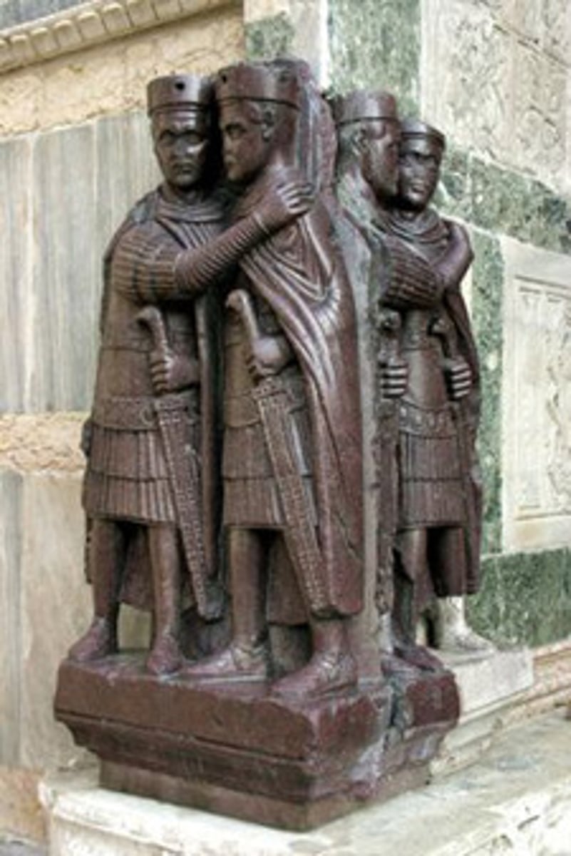 <p>Historical Context:</p><p>The sculpture is from the Swan Song of the Roman Empire</p><p>Imperial rule devolved from autocratic to dictatorial, and dissolving the empire between four rulers known as the Tetrarchs</p><p>Ambiguity:</p><p>The ambiguous nature of the figures, which don't appear to depict anyone in particular indicate how far the rift between the people and leadership has separated</p><p>The figures also evoke a sense of alertness with hostile overtures, perhaps alluding to the uncomfortability of a new government structure, and the people that they theoretically serve</p>