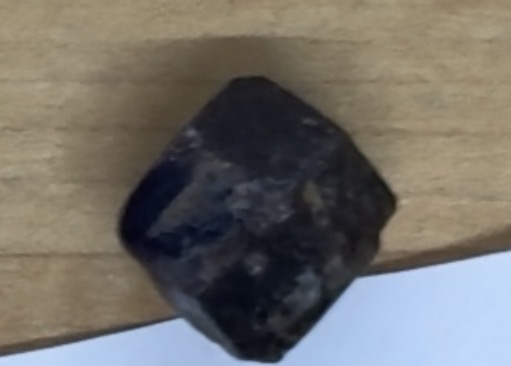 <p>soccer ball, black w/ pink/yellow spots </p>