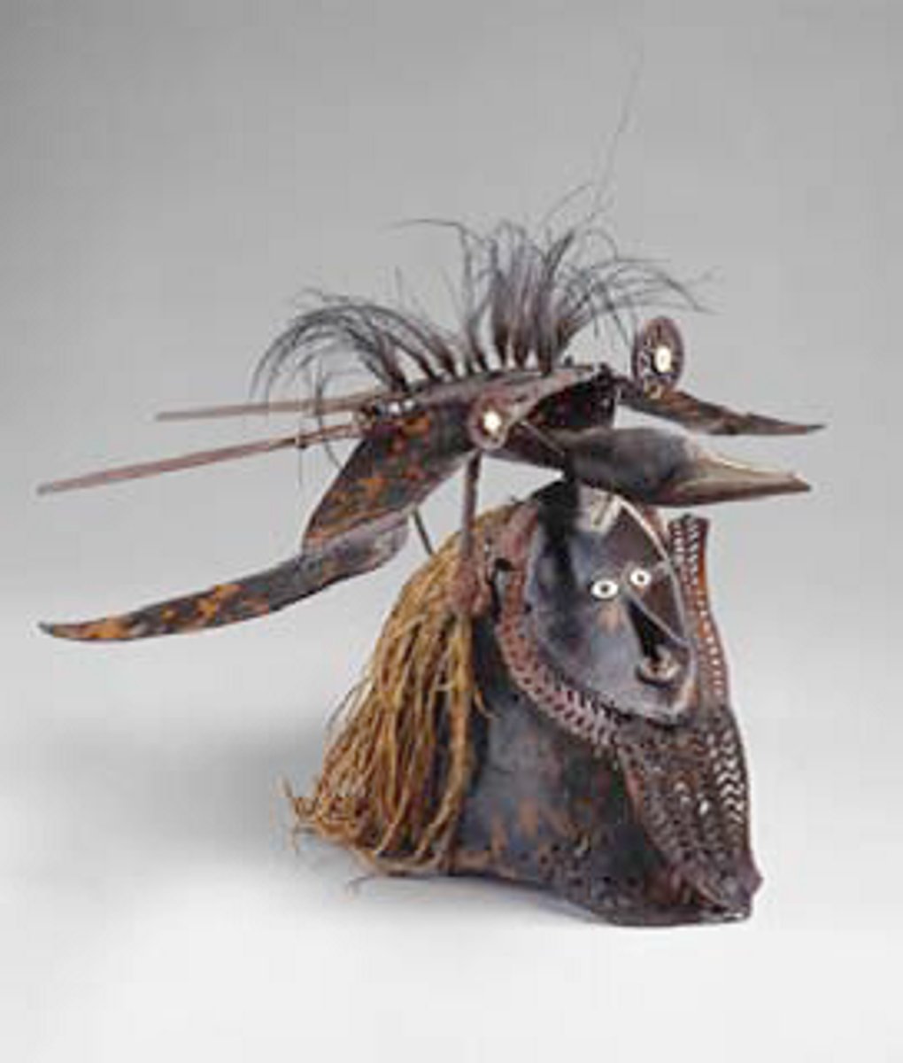 <p>Mabuiag island. Turtle shell, wood, fiber,feathers, shell. <br><br>Part of a costume made of grass for funerals, male initation rites, good harvest + hunt<br>performative ceermonies! fire, drums, chanting!<br>Retold mythology/stories.<br>Many dieties/ancestors have species associated with them, so ZOOMORPHIC!!!!!</p>