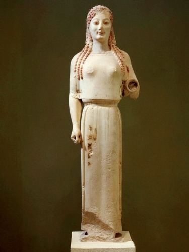 Archaic Greek. 
c. 530 B.C.E.
 Marble, painted details.

Generally offerings to gods like Athena, idealized Greek youth (humanistic worldview in idealism)

Once showed embroidered animals, most likely a Goddess since no others were clothed like this