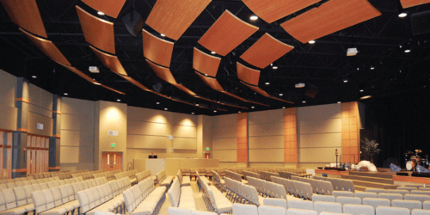 <p>one of a number of acoustic panels installed near the ceiling of a concert hall to reflect sound for improving the acoustic quality of music</p>