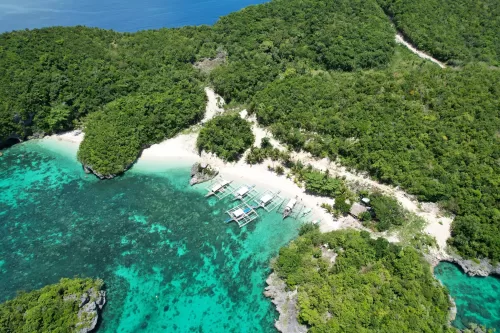 <p><span style="color: rgb(0, 0, 0)">Home to picturesque islets and beaches, mesmerizing coral gardens, and a waterfall cascading straight into the water.</span></p>