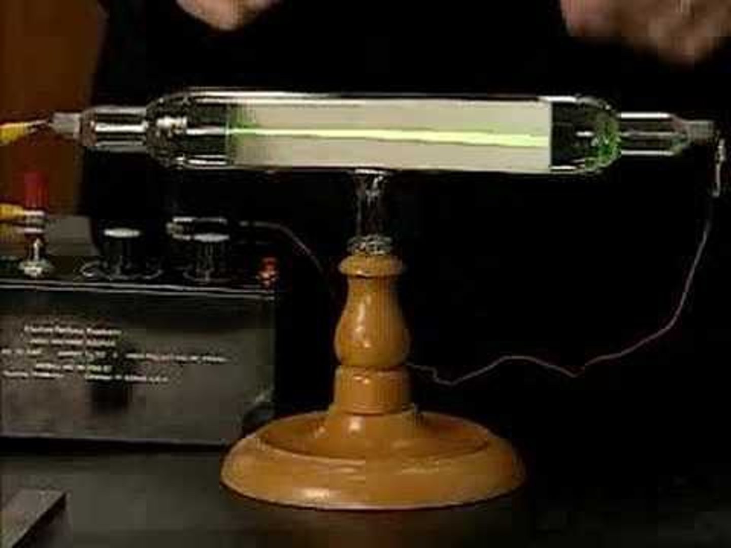 <p>a stream of electrons produced at the negative electrode of a tube containing a gas at low pressure</p>
