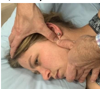 <p>pressing mandible medially/downwards</p>