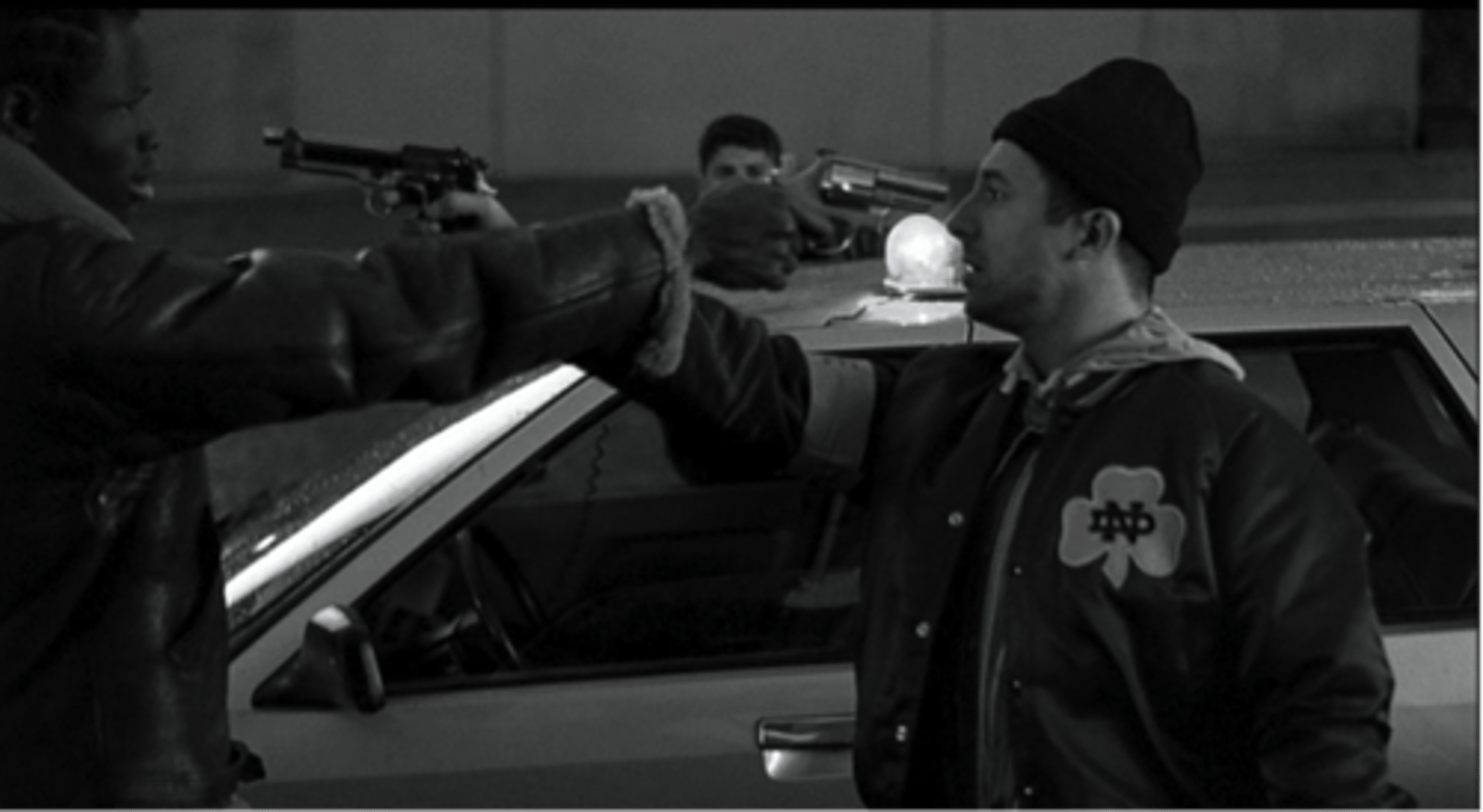 <p>Plain-clothes officer (wearing a Notre-Dame varsity jacket)<br>First seen on the roof <br>Actions and mistakes in the final scene encapsulate what Kassovitz is trying to show: accidental deaths and police 'bavures'</p>