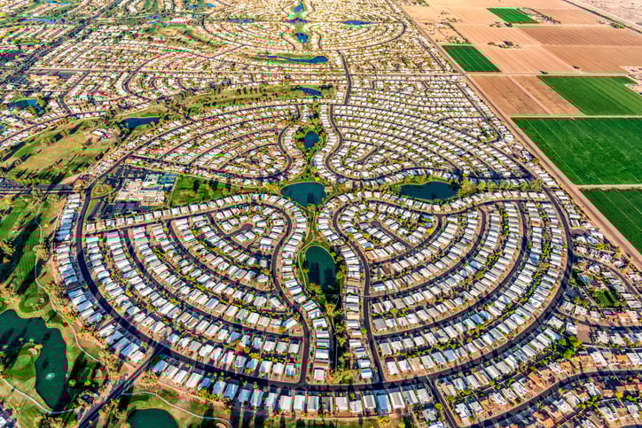 <p>the uncontrolled expansion of cities into surrounding rural land, leading to low-density development that is heavily car-dependent</p>