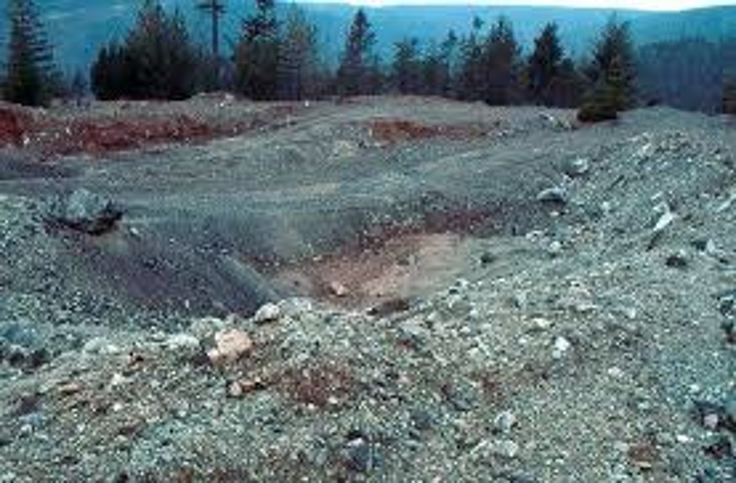 <p>rock waste in piles or ponds— contains toxic metals</p>