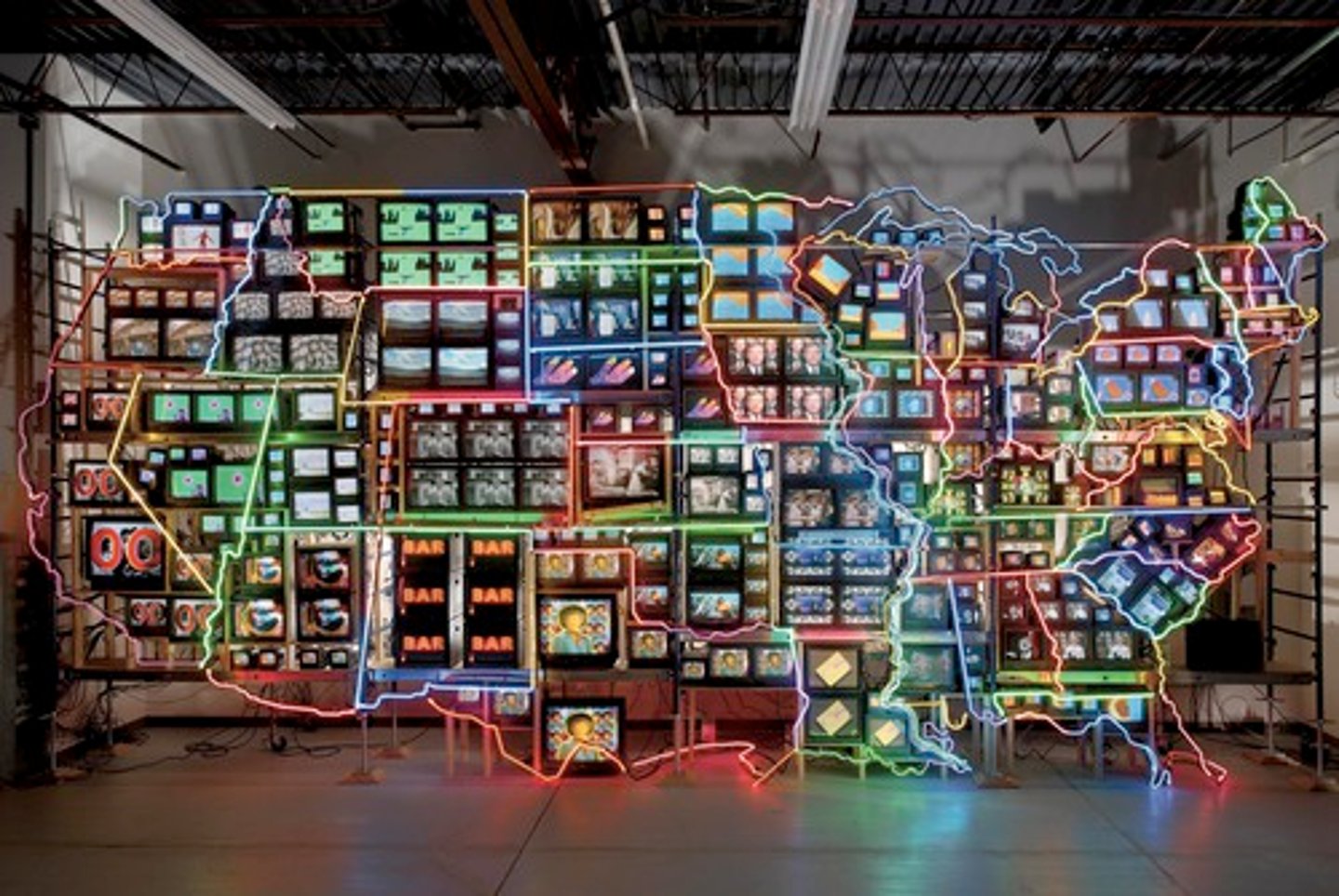 <p>Nam June Paik</p><p>1995 CE</p><p>Form: Mixed-media installation (49-channel closed-circuit, video installation, neon, steel, and electronic components)</p><p>Function: Describes how Paik was learning about the US through TV-based medium, rather than actual travel along the highways</p><p>The installation is made of over 300 TV monitors that are set into a neon light outline of the United States. Each state has its own show playing and the installation includes live streaming video of the viewer looking at the artwork. He used the words electronic superhighway to describe learning about the US through TV-based medium, rather than actual travel along the highways</p>