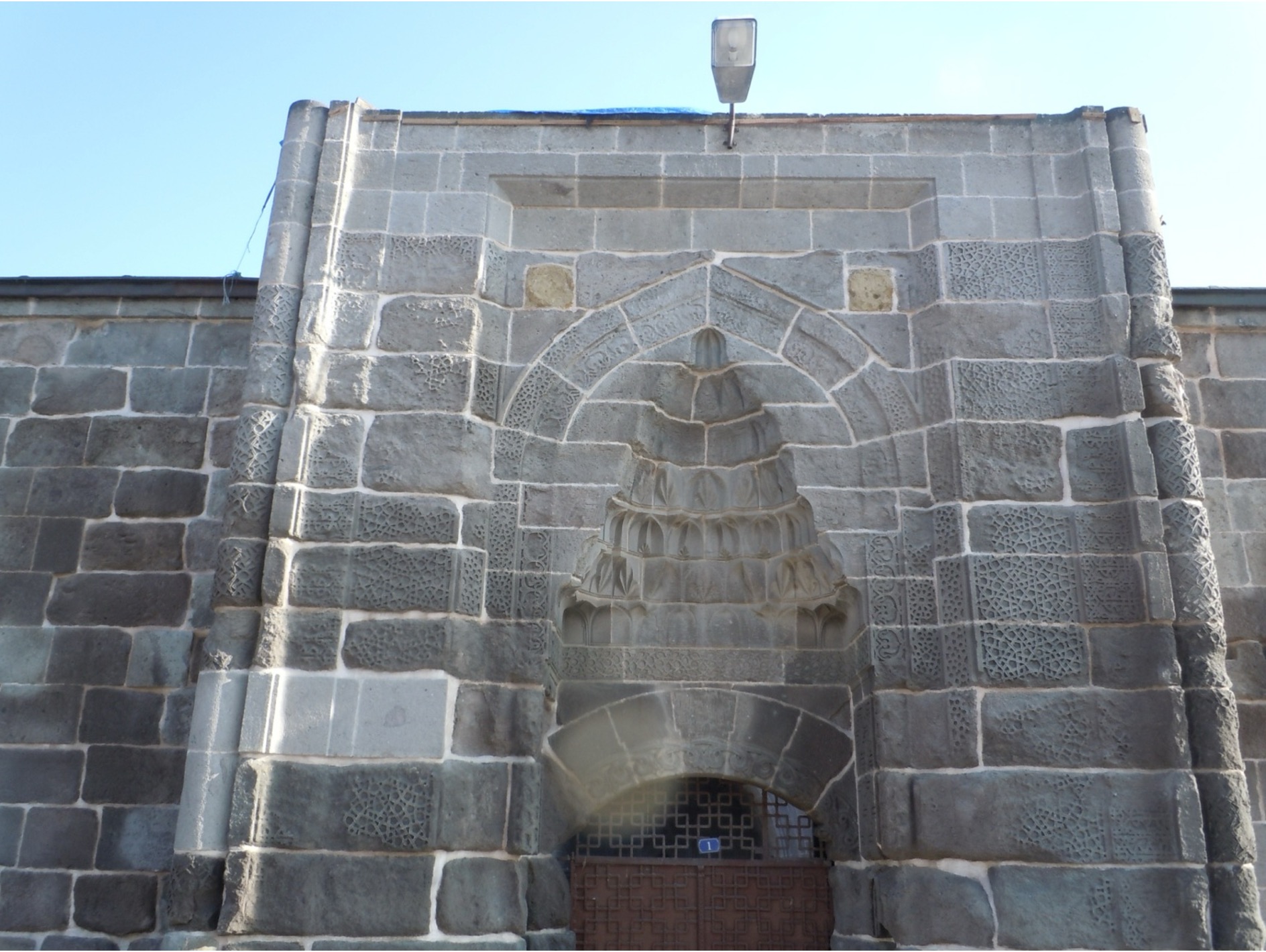 <ul><li><p><span style="font-family: &quot;Aptos Display&quot;, sans-serif">Kayseri is in Central Anatolia (the first </span><span>capital</span><span style="font-family: &quot;Aptos Display&quot;, sans-serif"> of the Seljuks of Rum)</span></p></li><li><p class="MsoListParagraphCxSpMiddle"><span style="font-family: &quot;Aptos Display&quot;, sans-serif">Khuand Katun was the wife of one of the Anatolian </span><span>Seljuk</span><span style="font-family: &quot;Aptos Display&quot;, sans-serif"> Sultans</span></p></li><li><p class="MsoListParagraphCxSpMiddle"><span style="font-family: &quot;Aptos Display&quot;, sans-serif">Very simple, stark stone construction – also based in part on Armenian architecture</span></p><ul><li><p class="MsoListParagraphCxSpMiddle"><span style="font-family: &quot;Aptos Display&quot;, sans-serif">Inside has virtually no decoration</span></p></li></ul></li><li><p class="MsoListParagraphCxSpMiddle"><span style="font-family: &quot;Aptos Display&quot;, sans-serif">The mosque at top is hypostyle, but has no courtyard (and is smaller, so easier to heat)</span></p><ul><li><p class="MsoListParagraphCxSpMiddle"><span style="font-family: &quot;Aptos Display&quot;, sans-serif">A simple dome covers the central square, and another is over the mihrab niche</span></p><ul><li><p class="MsoListParagraphCxSpMiddle"><span style="font-family: &quot;Aptos Display&quot;, sans-serif">Central dome uses a Byzantine arrangement </span><span> It uses a dome pierced with windows, and simple <strong>pendentives</strong> instead of squinches</span></p><ul><li><p class="MsoListParagraphCxSpMiddle"><span style="font-family: &quot;Aptos Display&quot;, sans-serif">Pendentive: alternate solution for creating a circular space for a dome in a square room – a slightly curved, 3-D triangle in each corner of the cubic room</span></p></li></ul></li></ul></li><li><p class="MsoListParagraphCxSpMiddle"><span style="font-family: &quot;Aptos Display&quot;, sans-serif">The entrance is on the right side, to keep it closer to Khuand Khatun’s tomb, which has complex geometric ornamentation carved into the stone)</span></p></li></ul></li><li><p class="MsoListParagraphCxSpMiddle"><span style="font-family: &quot;Aptos Display&quot;, sans-serif"><strong>This külliye</strong> (mosque complex) had the mosque, the tomb of the founder, and a madrasa</span></p></li></ul><p></p>
