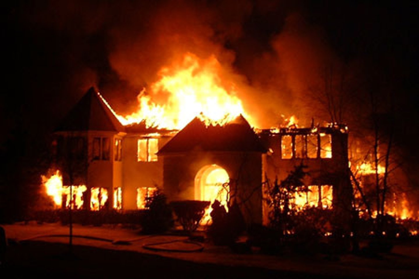 <p>to destroy or to be destroyed with fire (usually buildings)</p>