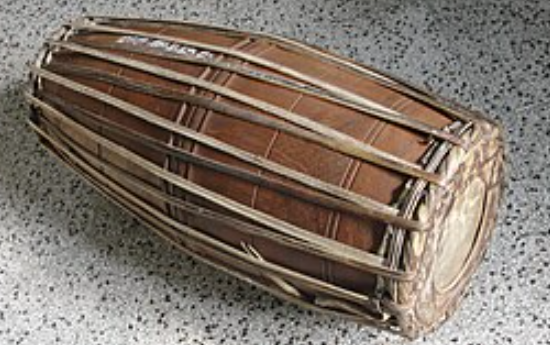 <p>A two-headed drum that serves as the primary rhythmic instrument in Carnatic music.</p>