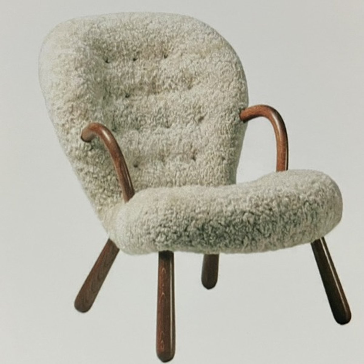 <p>Material: molded fiberglass shell upholstered in faux sheepskin/ shearling, solid ashwood frame</p><p>Dimensions:</p><p>27.5" x 31.8" x 30.3"</p><p>SH: 15.7"</p>