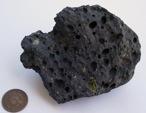 <p>a type of rock that forms from the cooling of molten rock at or below the surface</p>