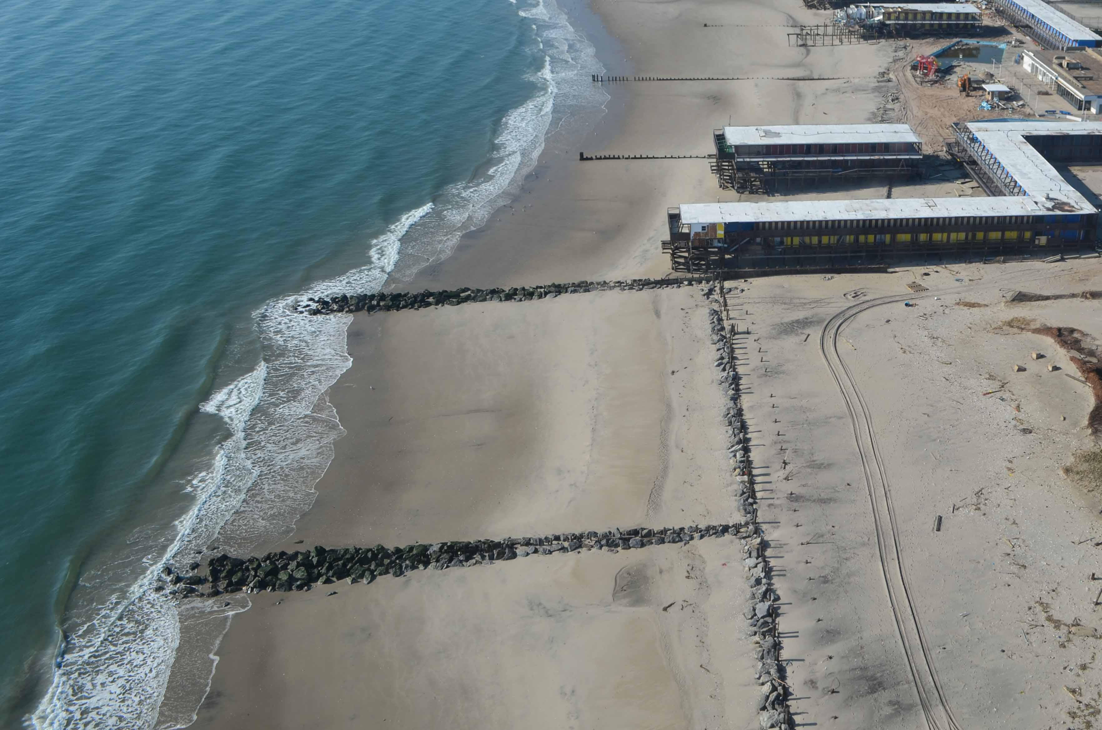 <p>Extension of rock placed perpendicular to the beach to trap sand from longshore drift</p>