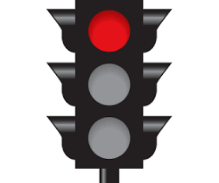 Stop and wait for the light to change. Come to a complete stop at the stop line, before the crosswalk, or before entering the intersection.