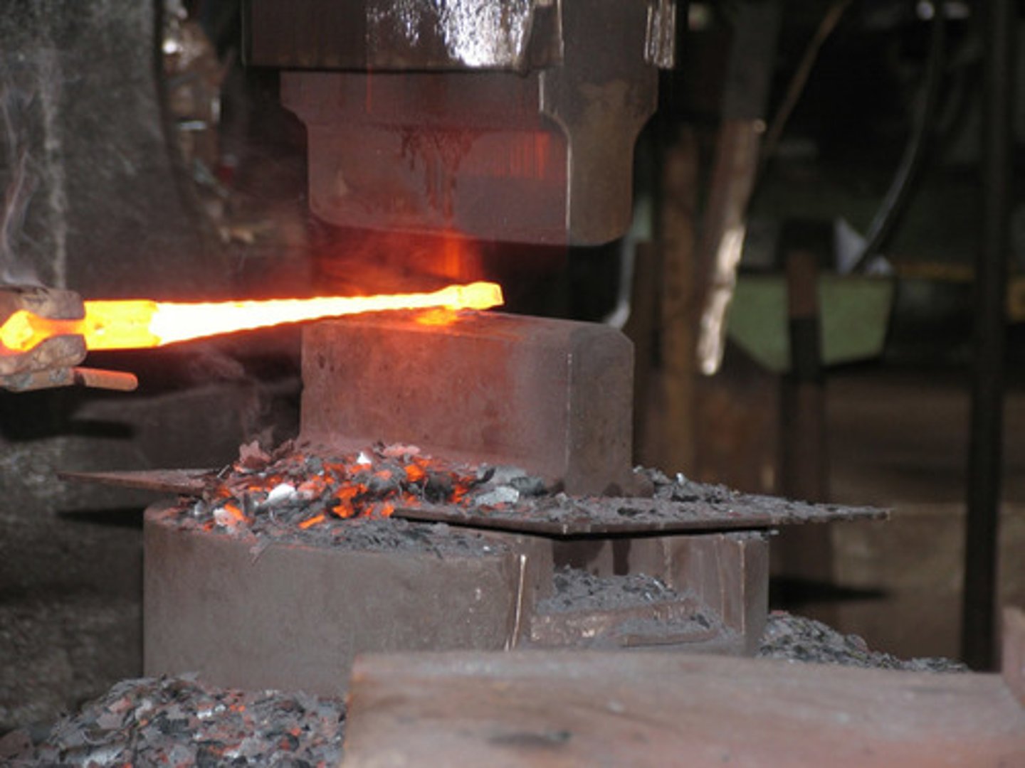 <p>the shaping of metal, usually done by hammering</p>