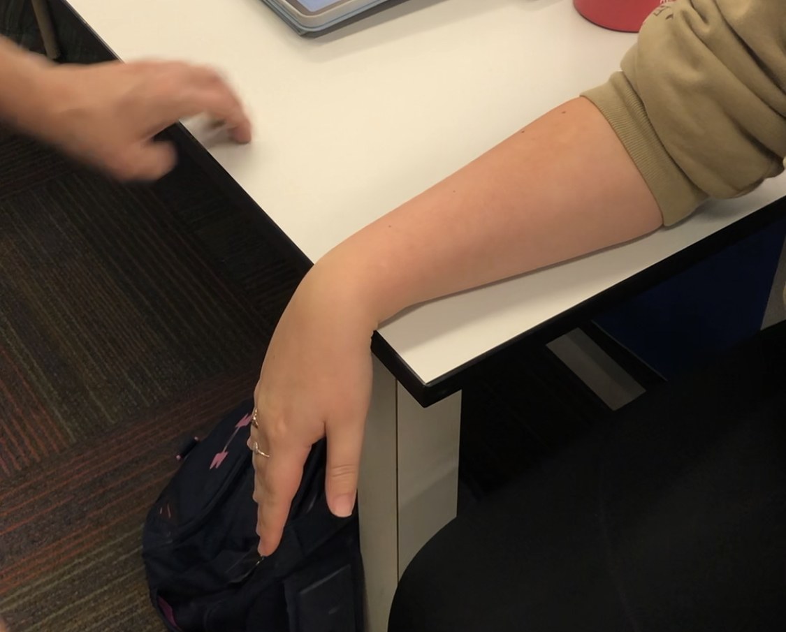 -Forearm on the table in prone with wrist and hand dangling off the side
-Distal end of the forearm, cup your hand underneath it