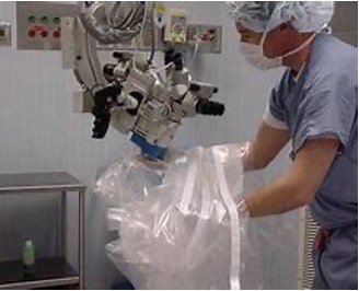 <p>maintain sterile field, requires practice to place drape on microscope, best if circulating nurse can reach inside drape and pill it over the scope as the ST places it, perforated sections over eye pieces are removed, use caution with lens caps to avoid contamination </p>