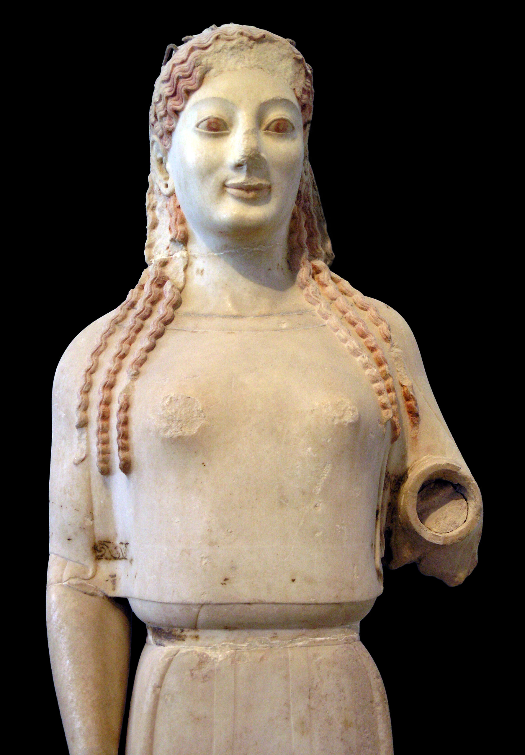 <p>Archaic period. 520-530 BCE. Painted marble. More naturalistic features (face and hair). Women were often depicted as clothed, while men were often depicted nude. </p>
