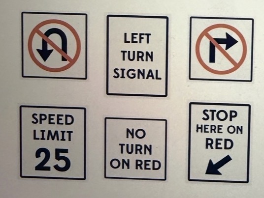 <p>white regulatory signs</p>