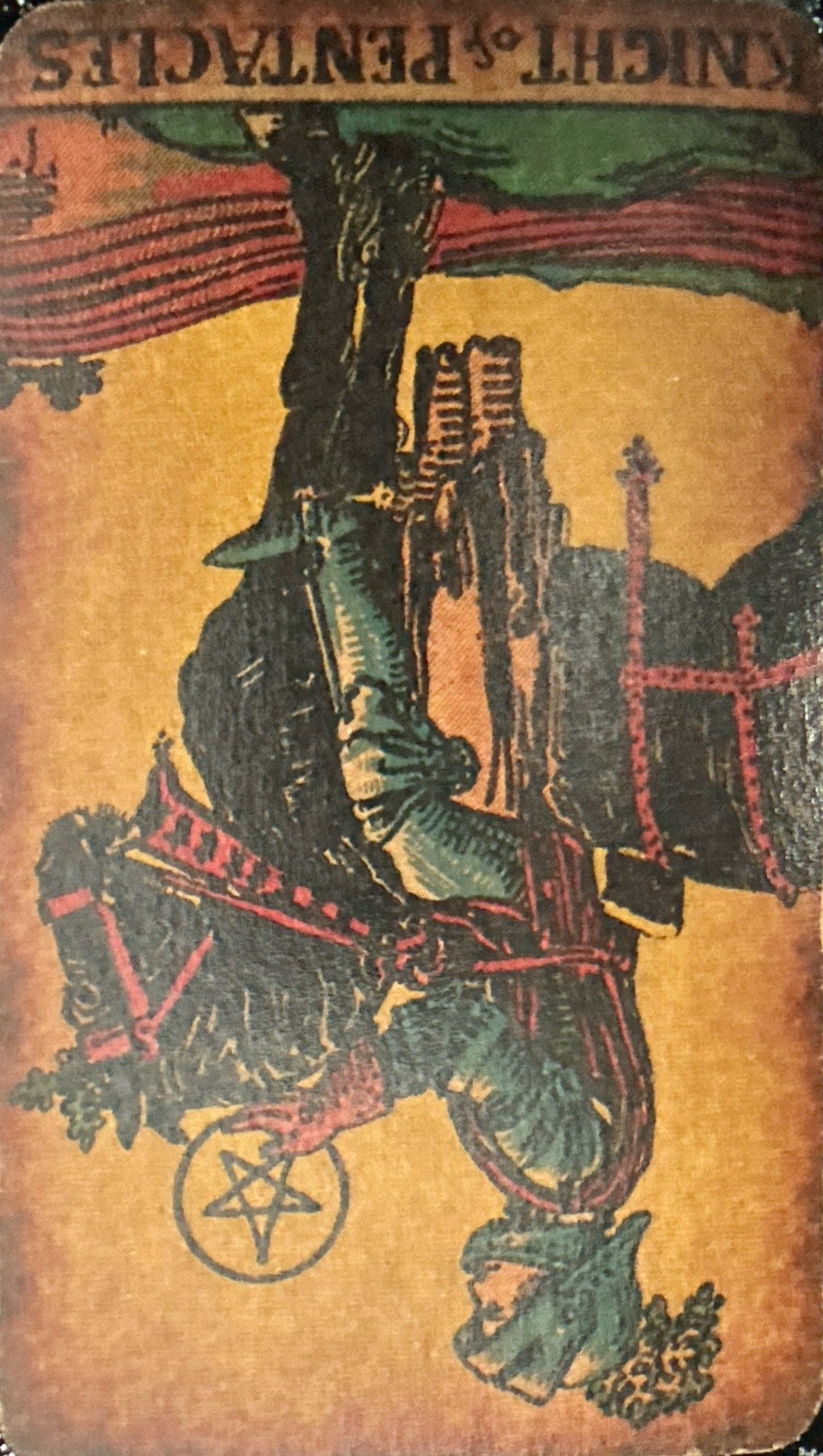 <p>XII - Knight of Pentacles (Reversed)</p>