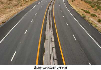 <p>A solid yellow line usually designates what on a four-lane divided highway or a one-way road?</p>