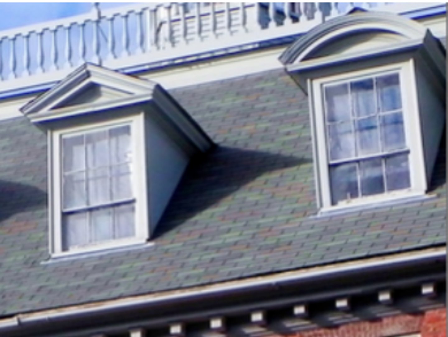 <p>a vertical window in a projection built out on a sloping roof</p>