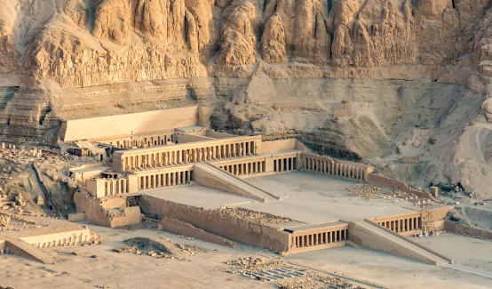 <p>Built against limestone cliffs with limestone, granite, and sandstone. Built in harmony with surroundings, and more of the temple is revealed as you climb the terraces. Used to be covered in sculptures and plants. Meant to be used while Hatshepsut was living and to honor her after her death. Hatshepsut often portrayed as female, male, and a sphinx. New Kingdom, Egypt. </p>