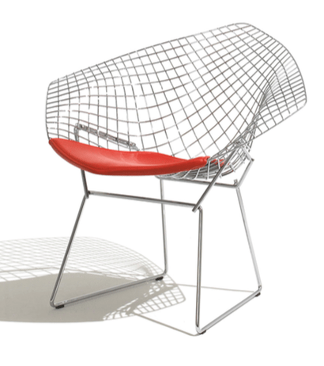 <p>This sculptural chair has a vinyl-coated, bent and welded steel-rod body and frame, and was designed by Harry Bertoia for Knoll Associates. It would have had a thin, upholstered cushion.</p>
