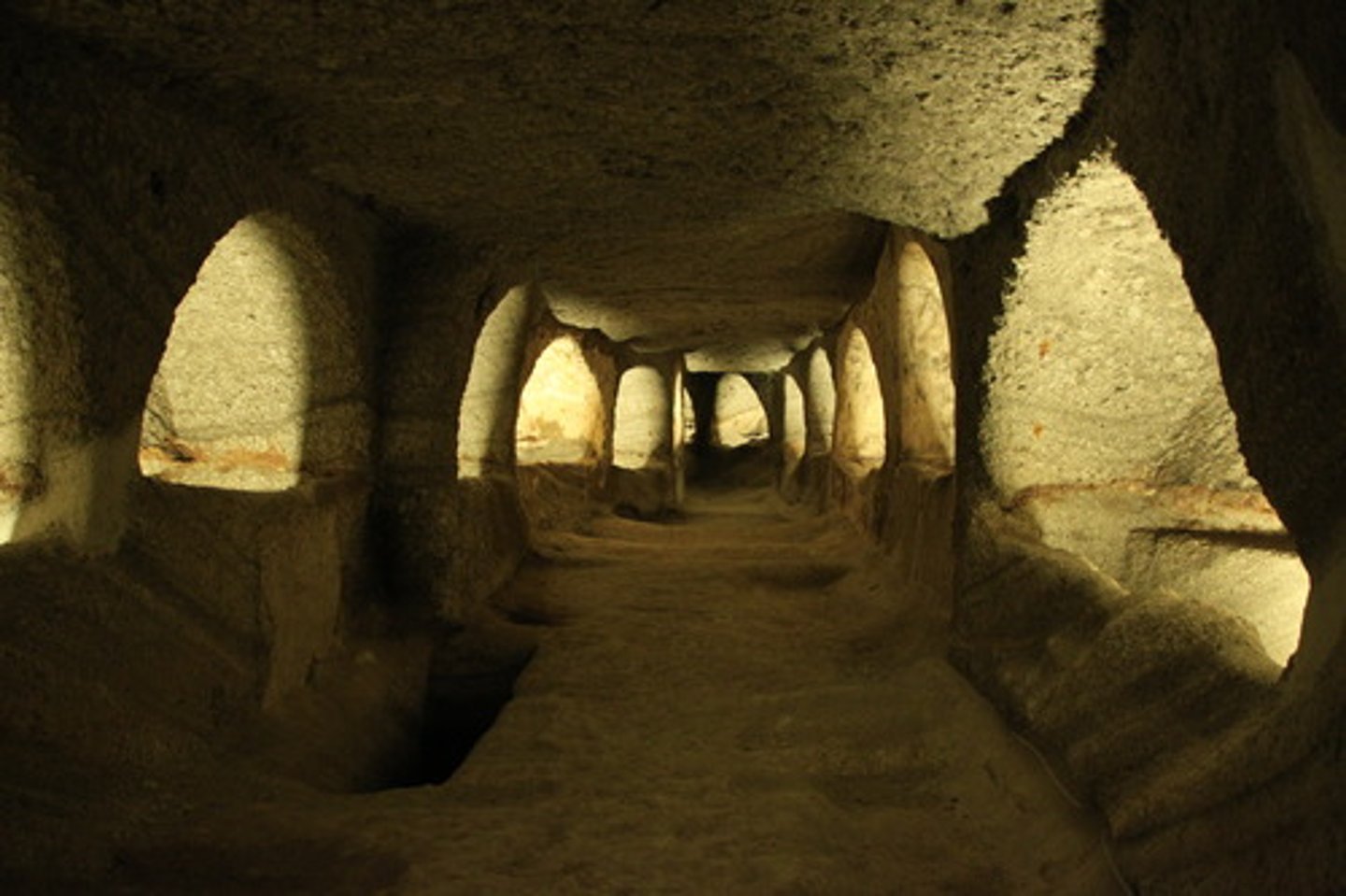 <p>Underground burial sites used by early Christians, often featuring wall paintings and frescoes.</p>