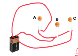 <p>The next two questions refer to the following figure below. The solid lines in the figure above represent high conductivity copper wire. The three capacitors shown each have C = 01 uF and the battery establishes a voltage difference V = 9V between the terminals. What statement is most correct? </p><p>(a) A, B, and C are in series</p><p>(b) A, B, and C are in parallel</p><p>(c)&nbsp;A is in parallel with the series combination of B and C</p><p>(d) A is in series with the parallel combination of B and C</p>