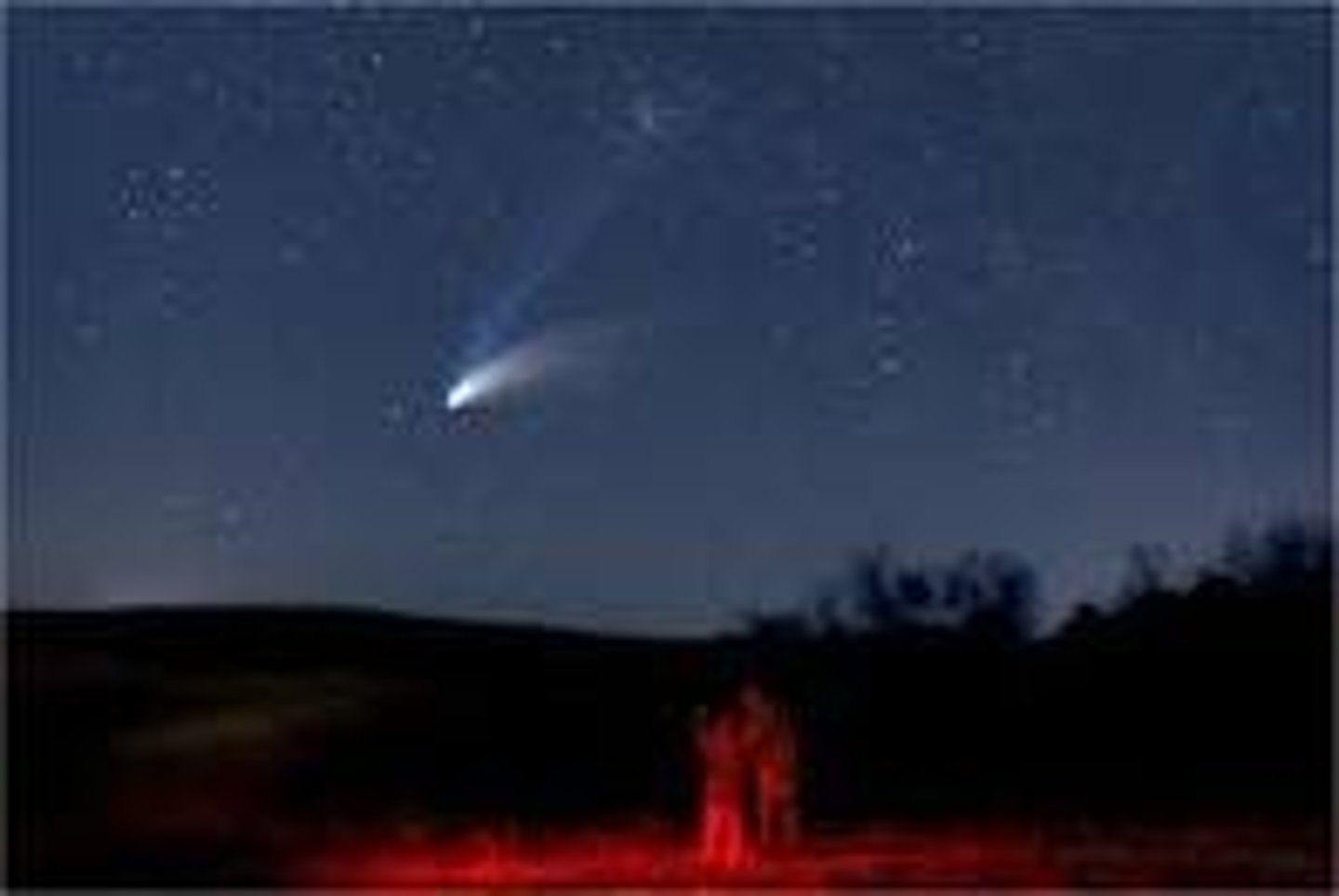 <p>A ball of frozen dust and rock that orbits the sun and has a tail that glows</p>