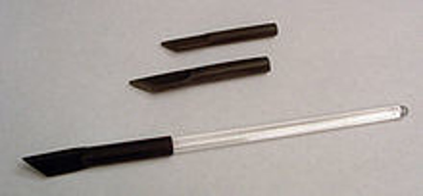 <p>A rubber tip with a flattened end used on a glass rod for scraping solids from containers</p>