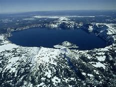 <p>What is the volcanic feature pictured here?</p><ol><li><p>fissure</p></li><li><p>crater</p></li><li><p>conduit</p></li><li><p>caldera</p></li></ol>