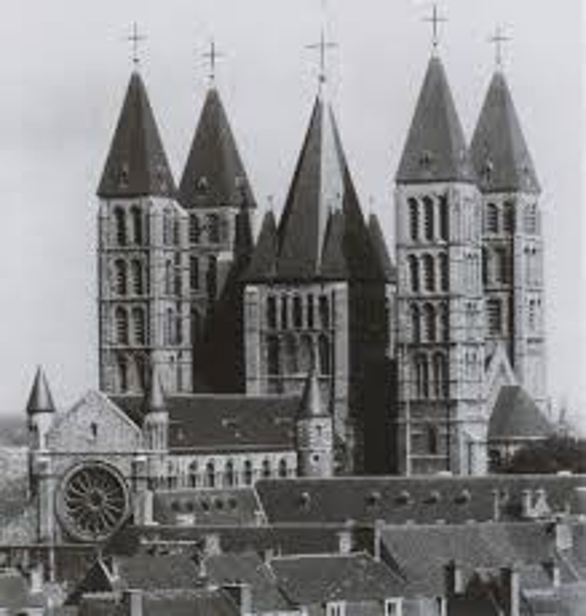 <p>belongs to 2 different styles: Romanesque nave &amp; transept (12th cent.) and Gothic choir (13thcent.).<br><br>It was built largely of black Tournai marble. It W\was inscribed on the UNESCO List Of World Heritage in 2000.</p>