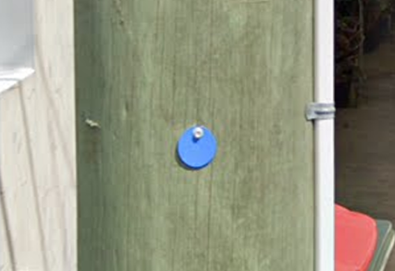 <p>Which Australian state can sometimes have a circular blue sticker on poles (or sometimes of another colour)?</p>