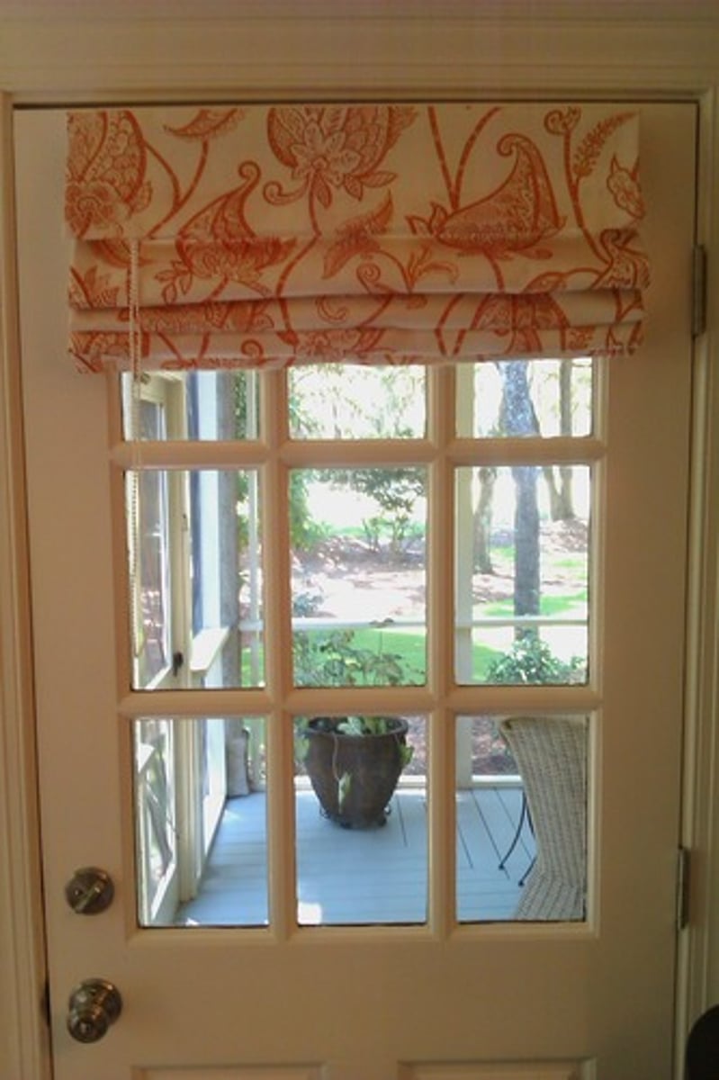 <p>Pull up with cords into accordian folds</p>