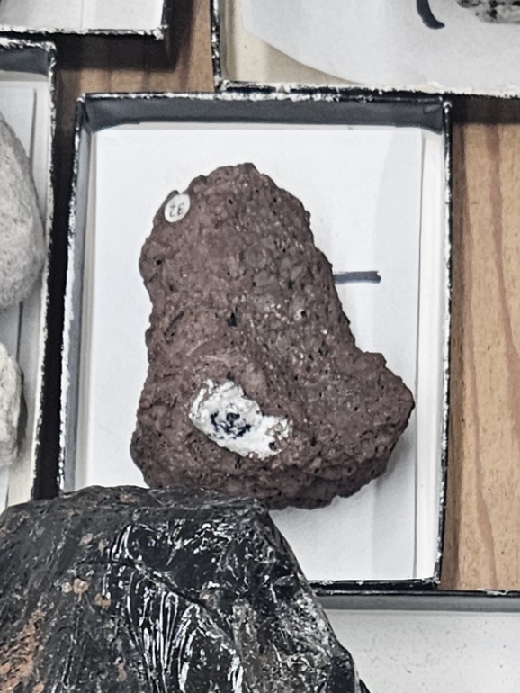 <p><strong>Mode of Cooling: Extrusive</strong></p><p><strong>Texture: Vesicular</strong></p><p><strong>Mineral Composition: Mafic</strong></p><p><strong>Ex Note: Has visible air bubbles aka Vesicular</strong></p>