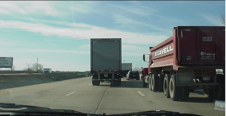 12\. Why is this a bad spot to be in as the driver in this scenario?

\
Can't make a lane change in any direction

You are in the fast lane on the highway and semi trucks aren't allowed there

You are in the semi truck drivers blind spot because you can't see their side mirrors