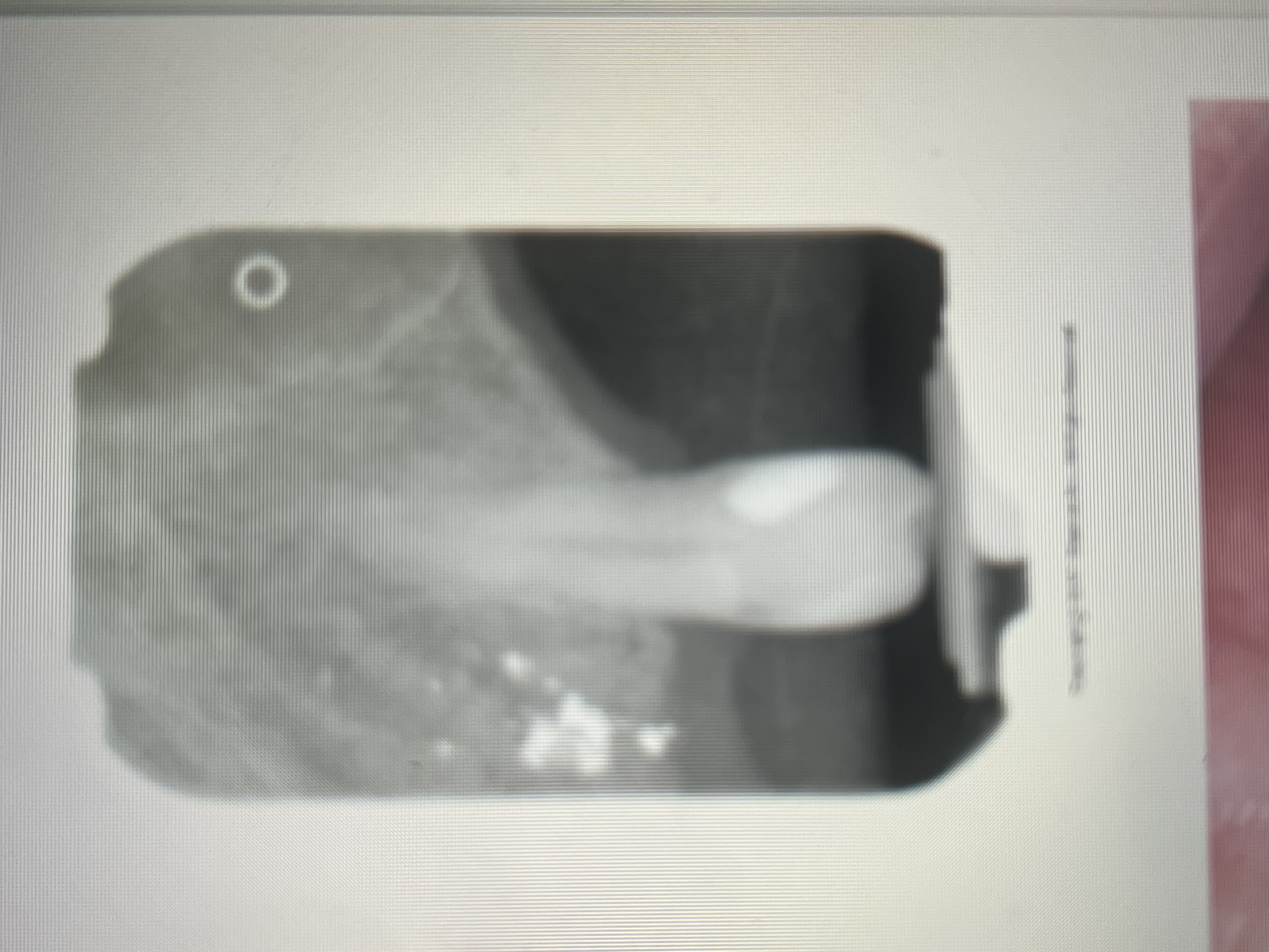 <p>As dense radiopacities with irregular borders.</p>