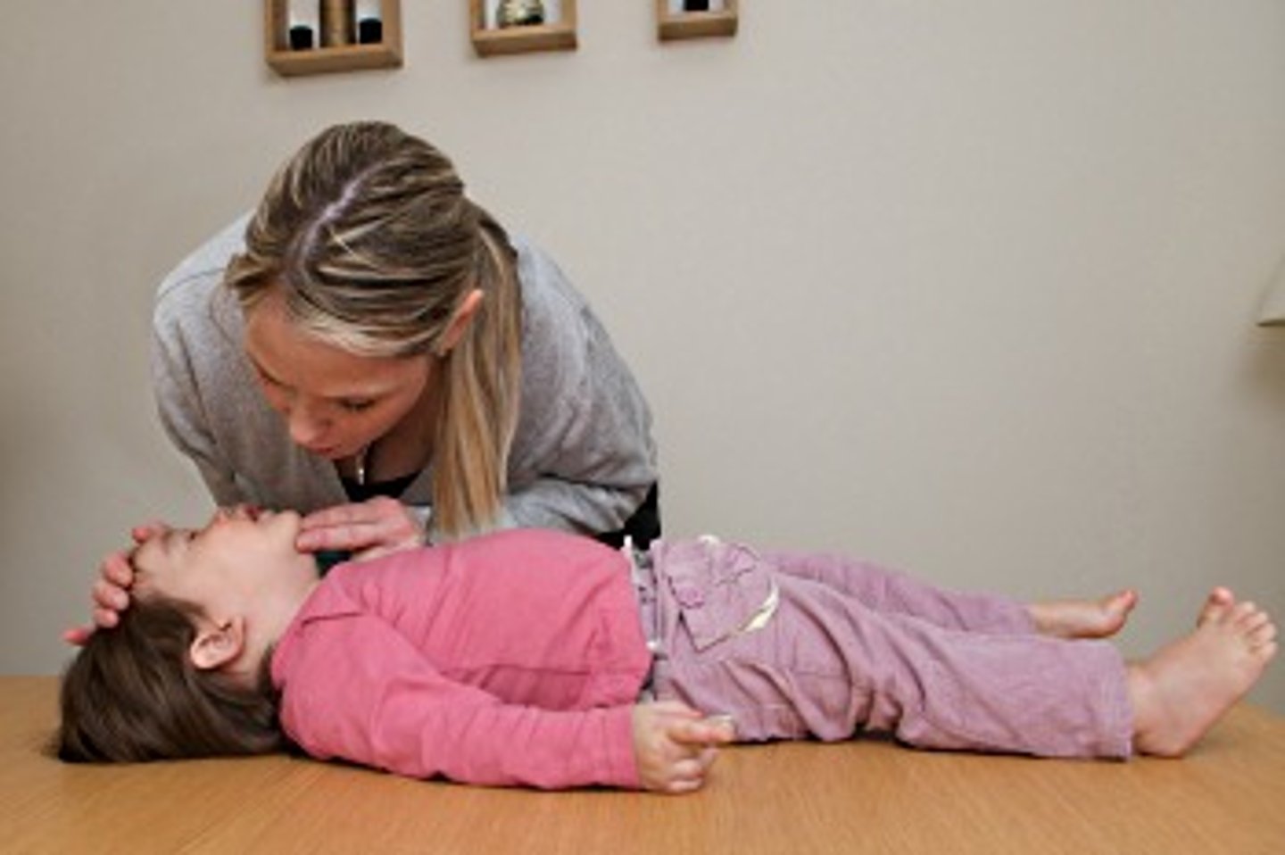 <p>1. check scene, then check child</p><p>2. obtain consent from parent/guardian if present</p><p>3. Tap on shoulder and shout, "Are you okay?"</p><p>4. No response, call 911 or if alone, give 2 minutes of care then call 911</p><p>5. Open airway, check for signs of life for no more than 10 seconds</p><p>6. give 2 rescue breaths if not breathing</p><p>7. If breaths go in, check for pulse and severe bleeding. If breaths do NOT go in, begin rescue breathing. No pulse, begin CPR/AED</p><p>8. If breathing, place in recovery position and monitor ABCs</p>