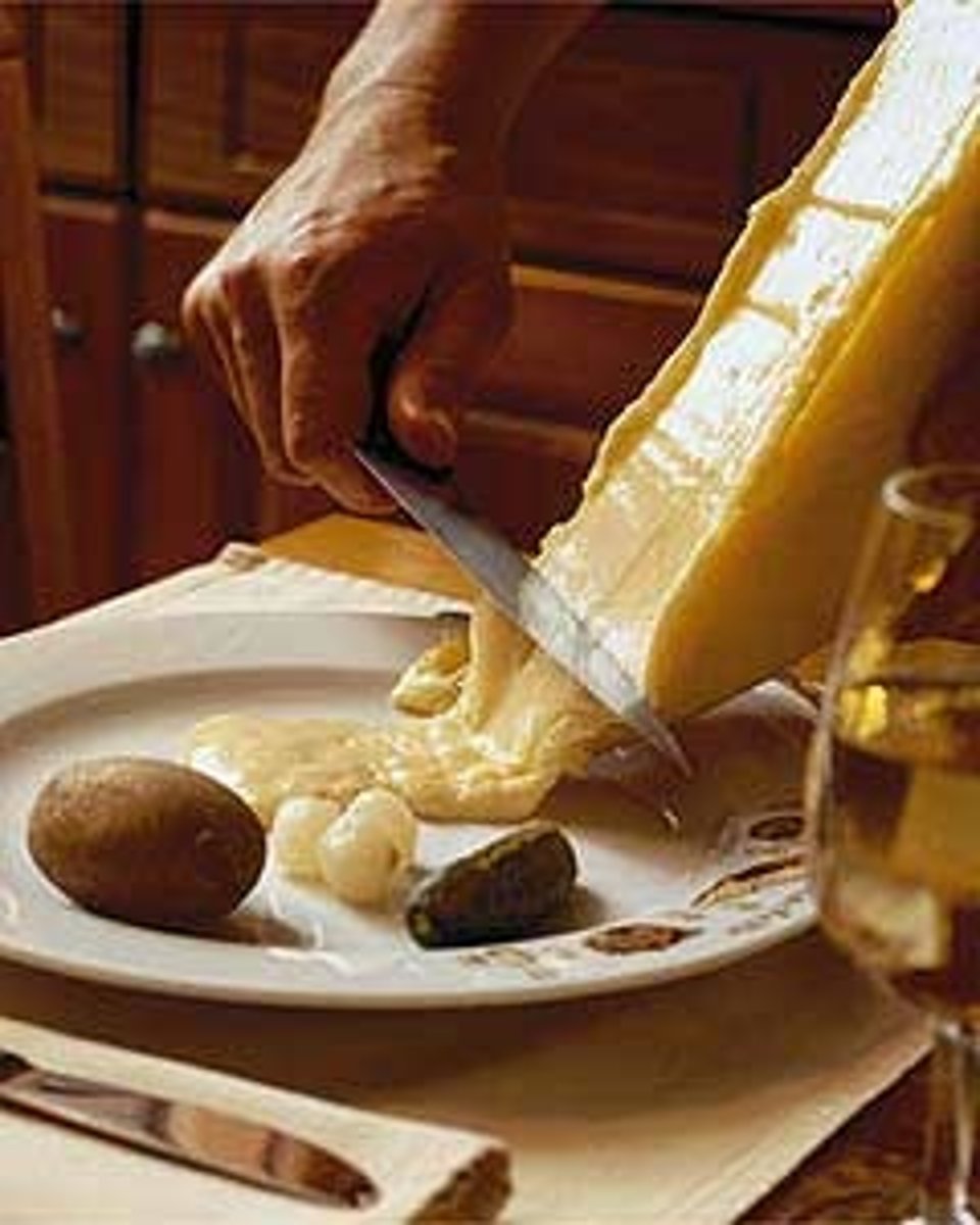 <p>melted cheese with charcuterie and potatoes</p>