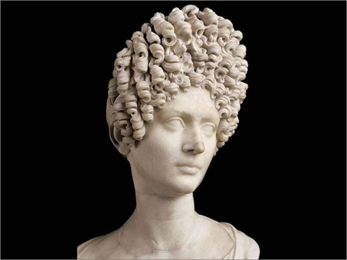 <p>90 C.E., Imperial, idealized beauty with graceful long neck and tilted head, cutting-edge fashionable coiffure, hair creates a dramatic interplay of light and shadow, hair created with a drill</p>