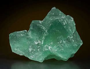 nonmetallic, light green color, white streak