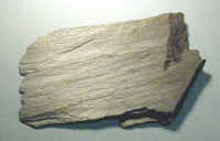 Luster: Satiny
Cleavage: Breaks along wrinkled or foliated planes
Info: small micaceous minerals barely visible, foliated