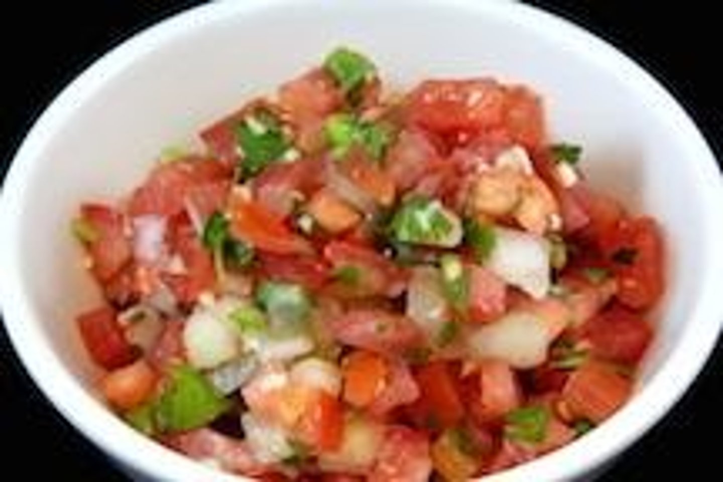 <p>is made from chopped tomato, onion, coriander leaves, fresh serranos (jalapeños or habaneros are used as alternatives), salt, and key lime juice.</p>