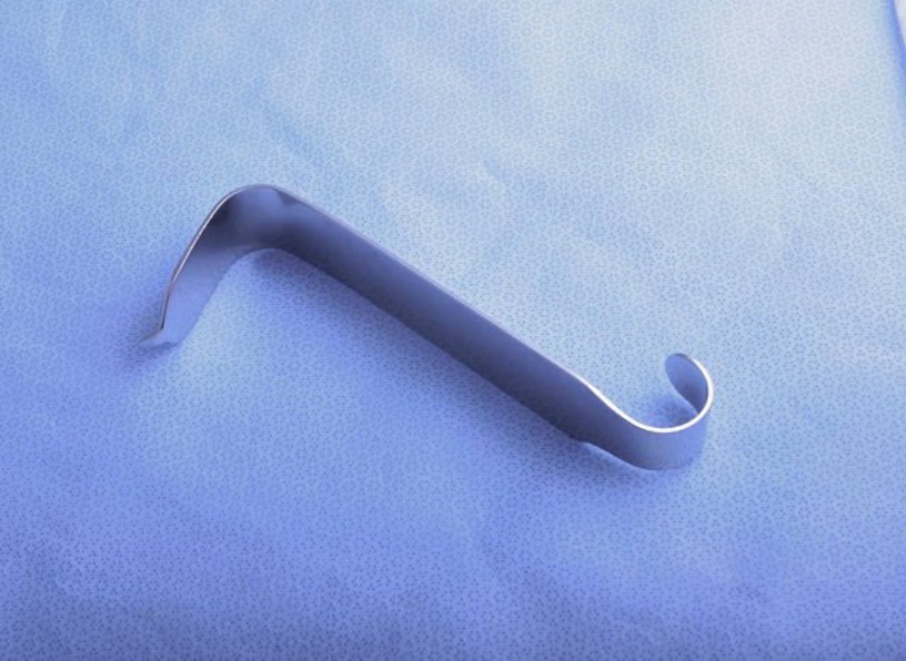<p>retract muscle and tissue away form spine, may attach roller gauze or kerlix and tie down to table so no one has to hold it in place </p>