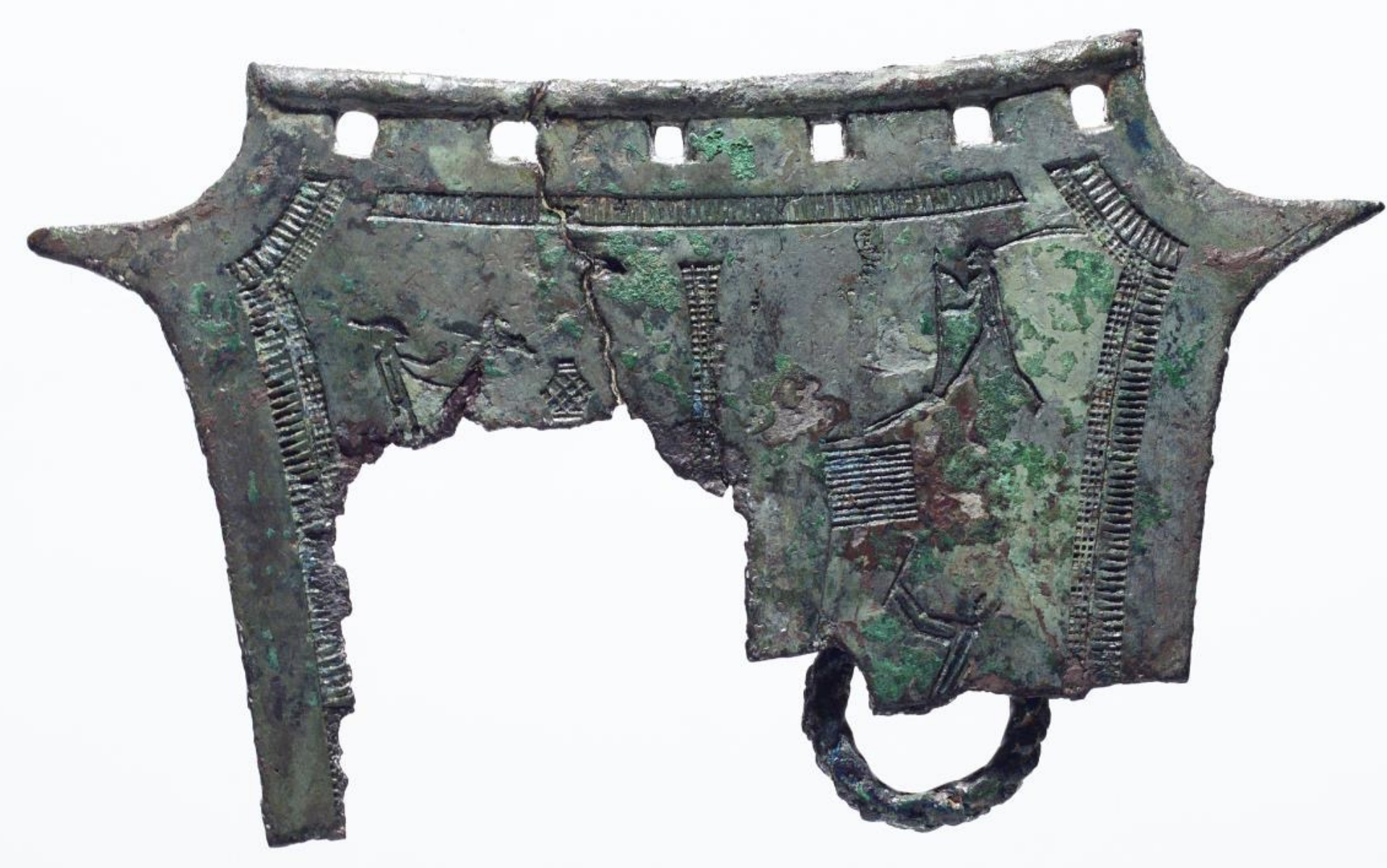 <p>Time: Bronze Age (1000 BCE - 300 BCE)<br>Found: Daejeon, South Chungcheong (대전, 충청남도)</p><p>Used in religious ceremonies, these artifacts often feature elaborate designs of daily farming activities; the holes on top indicate they were often suspended on walls for display during rituals. </p>