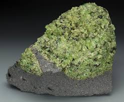 <p>Ultramafic, and you can tell because it’s GREEN. Intrusive due to the visible crystals (phaneritic) </p>